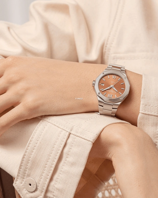 Baume & Mercier,Riviera 36mm,36mm,Stainless Steel,Orange Pink,Automatic,Day,Sapphire,Crystal Glass,10764