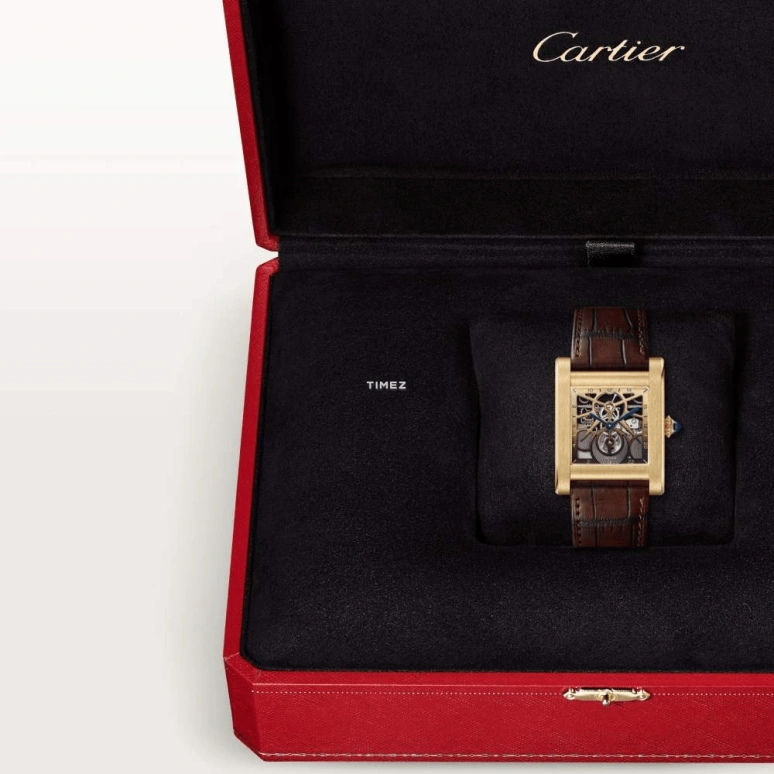 Cartier,Tank 35.20x27.80mm,35.20x27.80mm,Yellow Gold,Skeleton,Handwound,Sapphire,Crystal Glass,Rectangular,WHTA0021