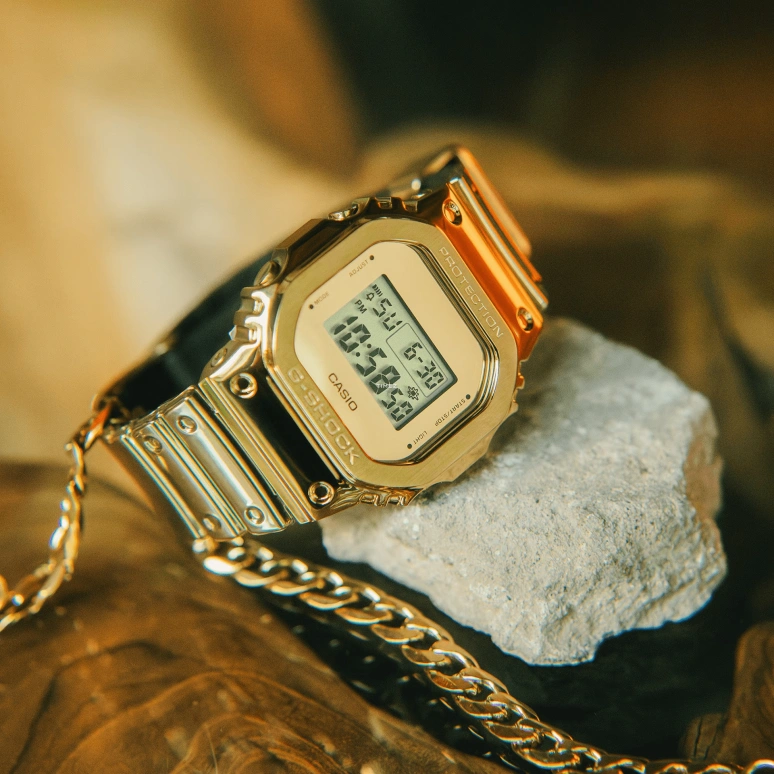 Casio,G-SHOCK 49.60x43.20mm,49.60x43.20mm,Resin,Gold,Quartz,Countdown,Chronograph,Month,Date,Hardlex,Square,GM5600YMG,GM5600YMG-9