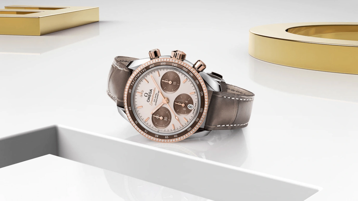Omega,Speedmaster (Non-Moonwatch) 38mm,38mm,Sedna Gold,Stainless Steel,Beige,Automatic,Chronograph,Date,Co-Axial Escapement,Column Wheel,52hours,In-house Caliber,324,324.28.38.50.02.002