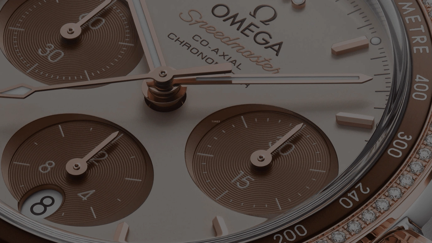 Omega,Speedmaster (Non-Moonwatch) 38mm,38mm,Sedna Gold,Stainless Steel,Beige,Automatic,Chronograph,Date,Co-Axial Escapement,Column Wheel,52hours,In-house Caliber,324,324.28.38.50.02.002