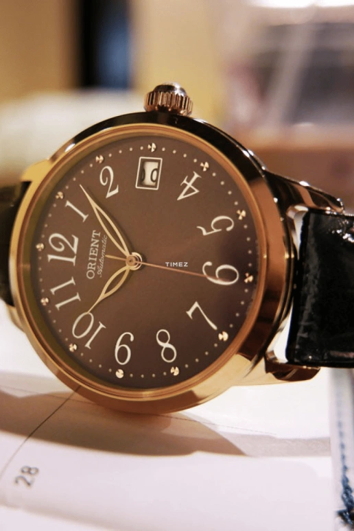 Orient,Other 35.50mm,35.50mm,Stainless Steel,Coffee,Automatic,Handwound,Day,Sapphire,Crystal Glass,FAC06001T