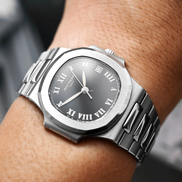 Patek Philippe,Nautilus 37mm,37mm,Stainless Steel,Black,Automatic,Day,In-house Caliber,3800,3800/1A-001