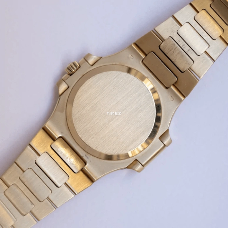 Patek Philippe,Nautilus 37mm,37mm,Yellow Gold,Gold,Automatic,Day,In-house Caliber,3800,3800/2J