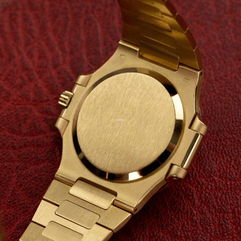 Patek Philippe,Nautilus 37mm,37mm,Yellow Gold,Gold,Automatic,Day,In-house Caliber,3800,3800/2J