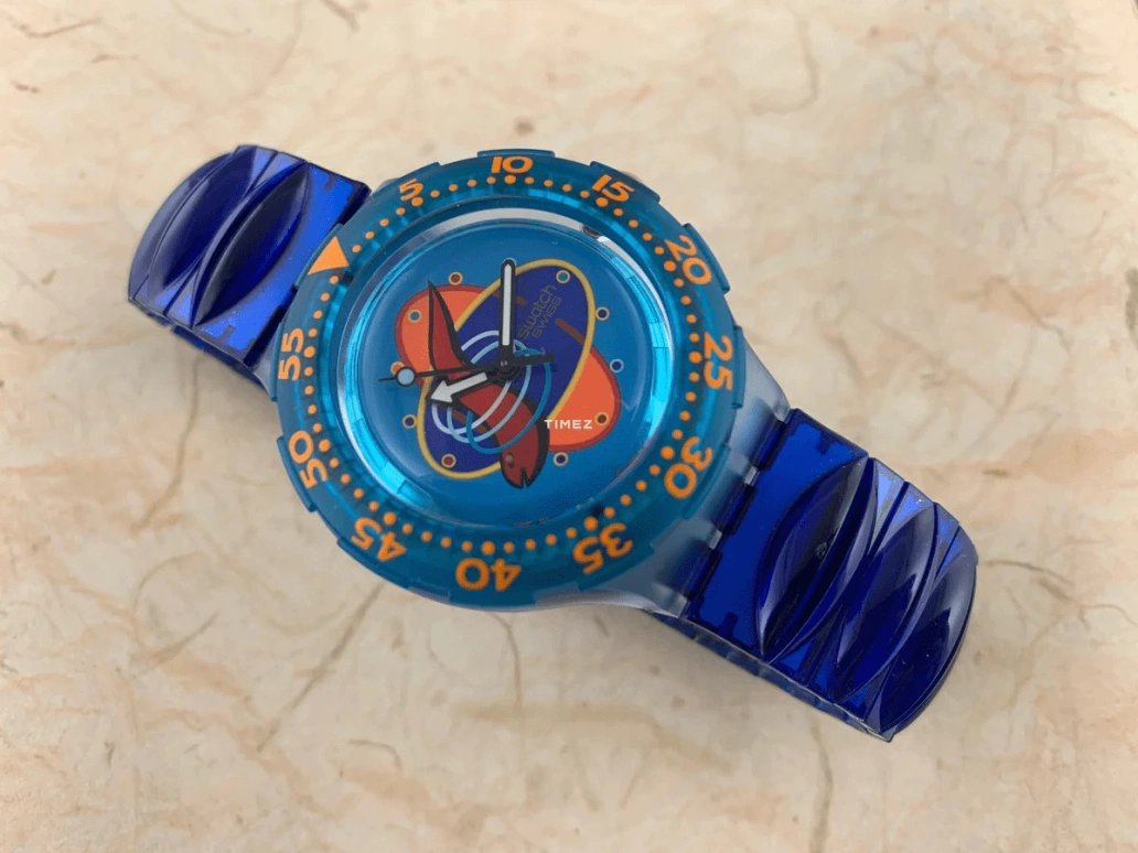 Swatch,Other 38mm,38mm,Plastic,Blue,Quartz,Sapphire,Crystal Glass,Tonneau,SDN114
