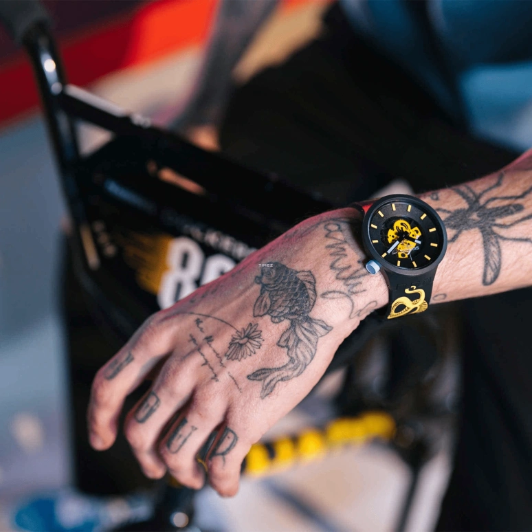 Swatch,Other 47mm,47mm,Bioceramic,Black,Yellow,Skeleton,Quartz,Sapphire,Crystal Glass,Round,SB03B109C